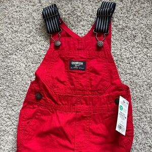 New with tags. Osh Kosh B’gosh red overalls. 12m